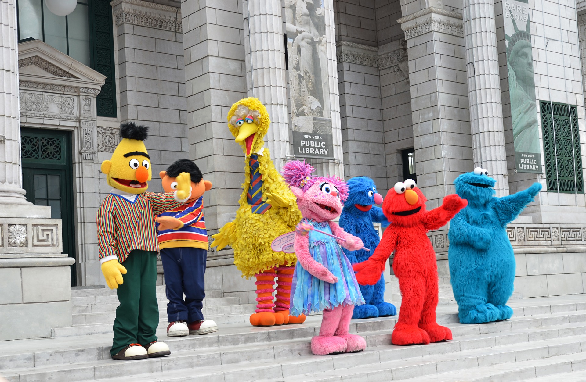 Many Sesame Street characters in a group.